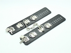 A series of three leather leather bound toy handcuffs lock hands tied selling leather handcuffs bundled couple toys